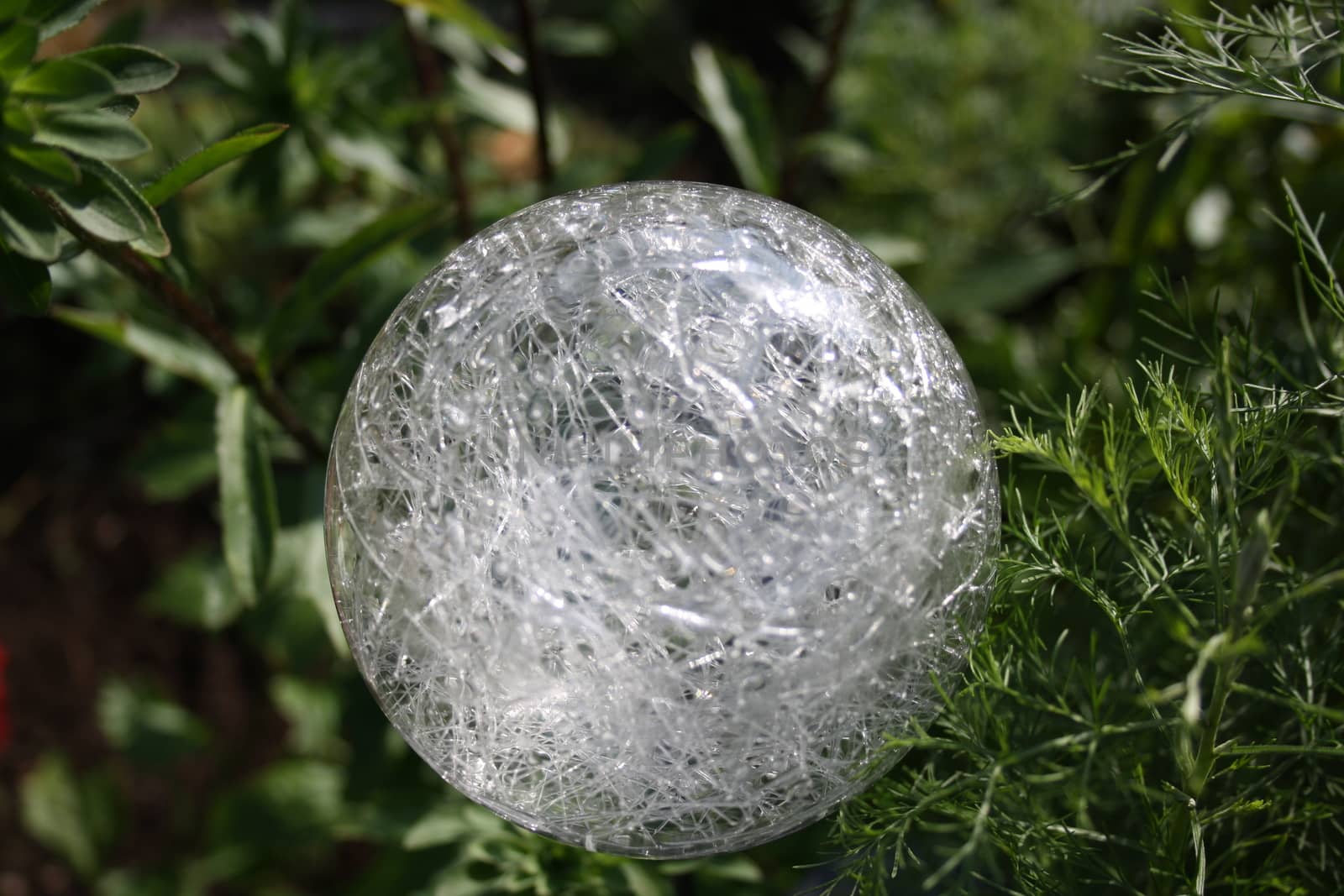 garden lamp in the form of a ball on a green background