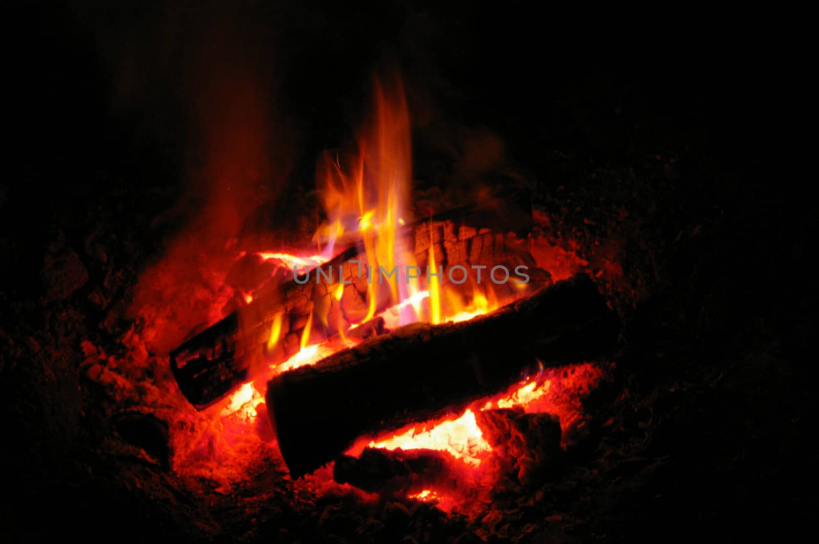 night bonfire, fire and smoke on a dark background