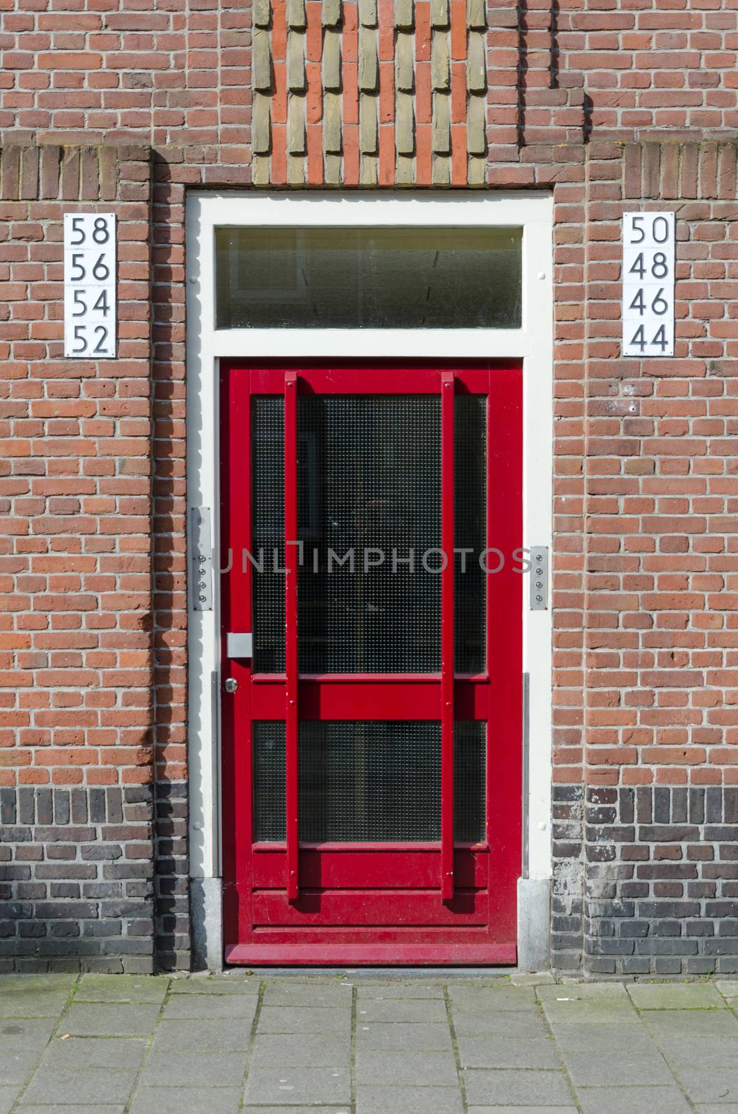Door outside apartment building in Amsterdam by siraanamwong