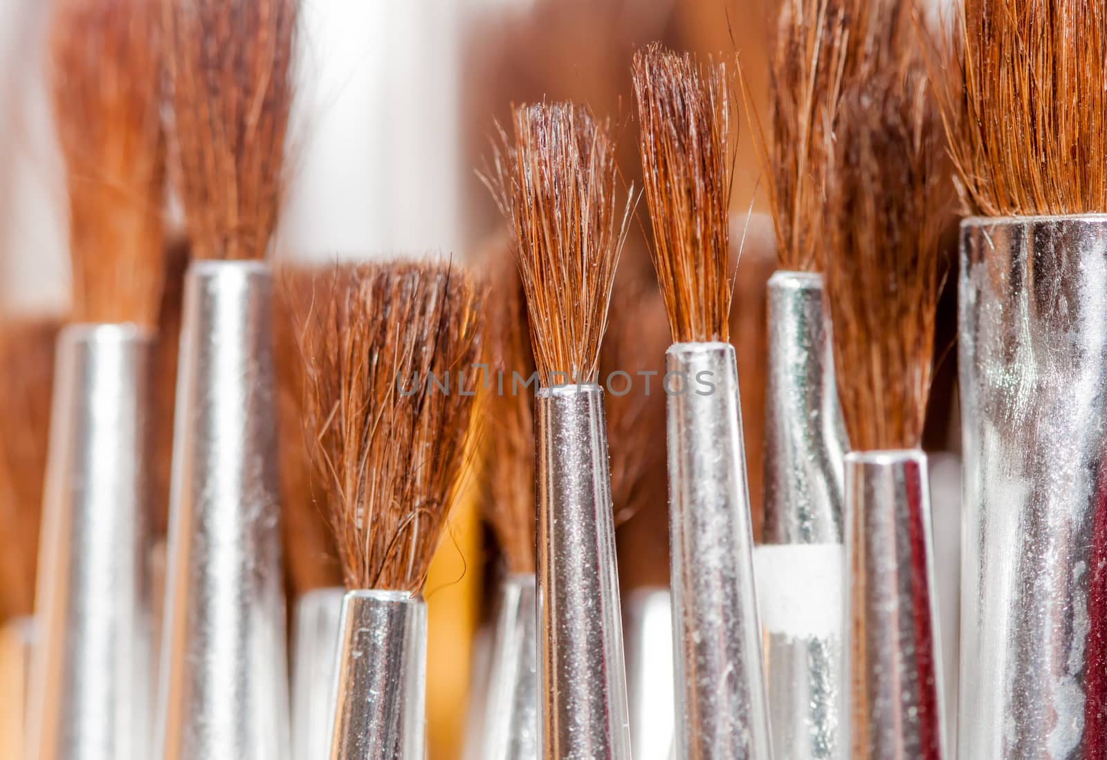 many brushes in art studio can be used as background