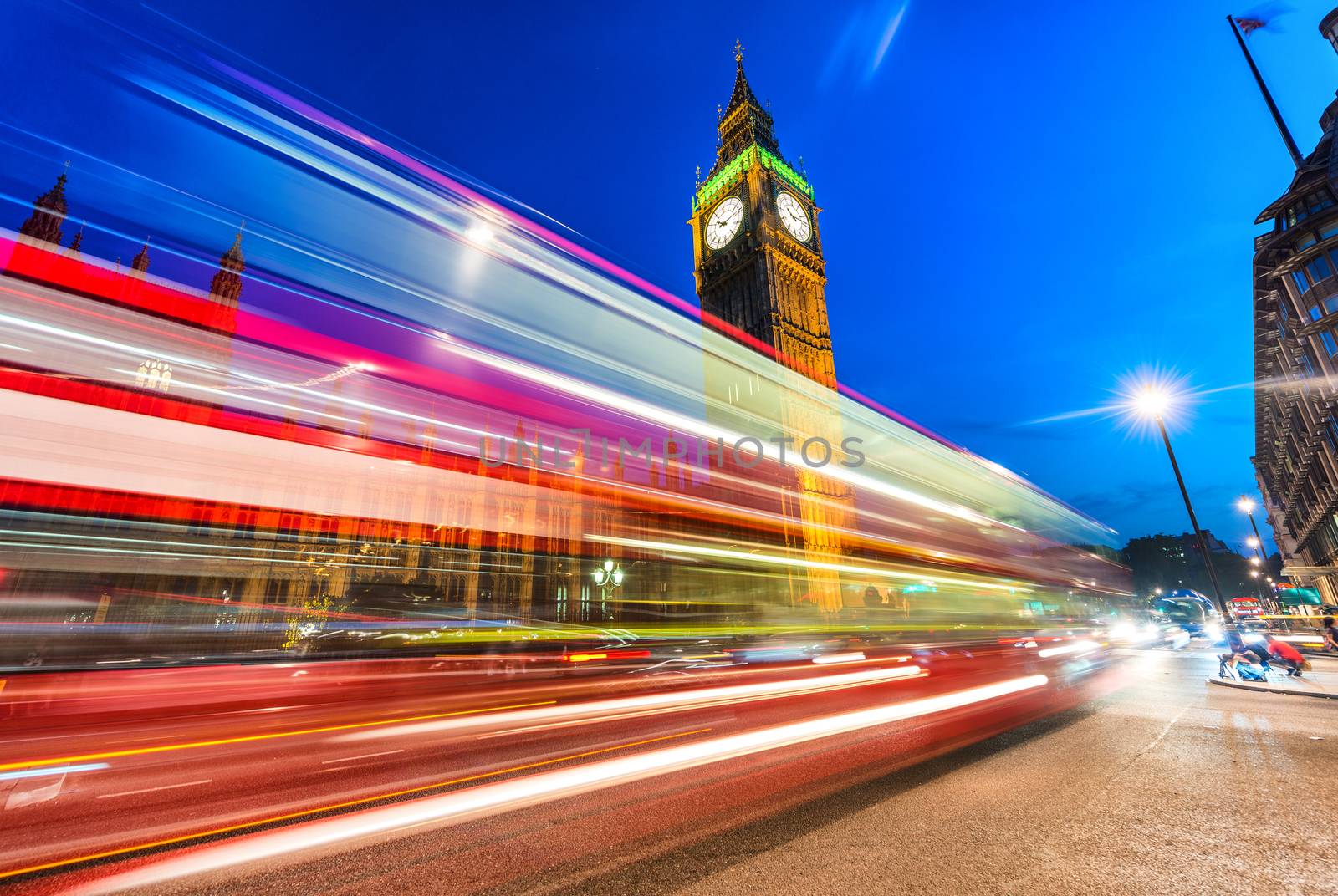 Beautiful bus light trails under Big Ben, London.