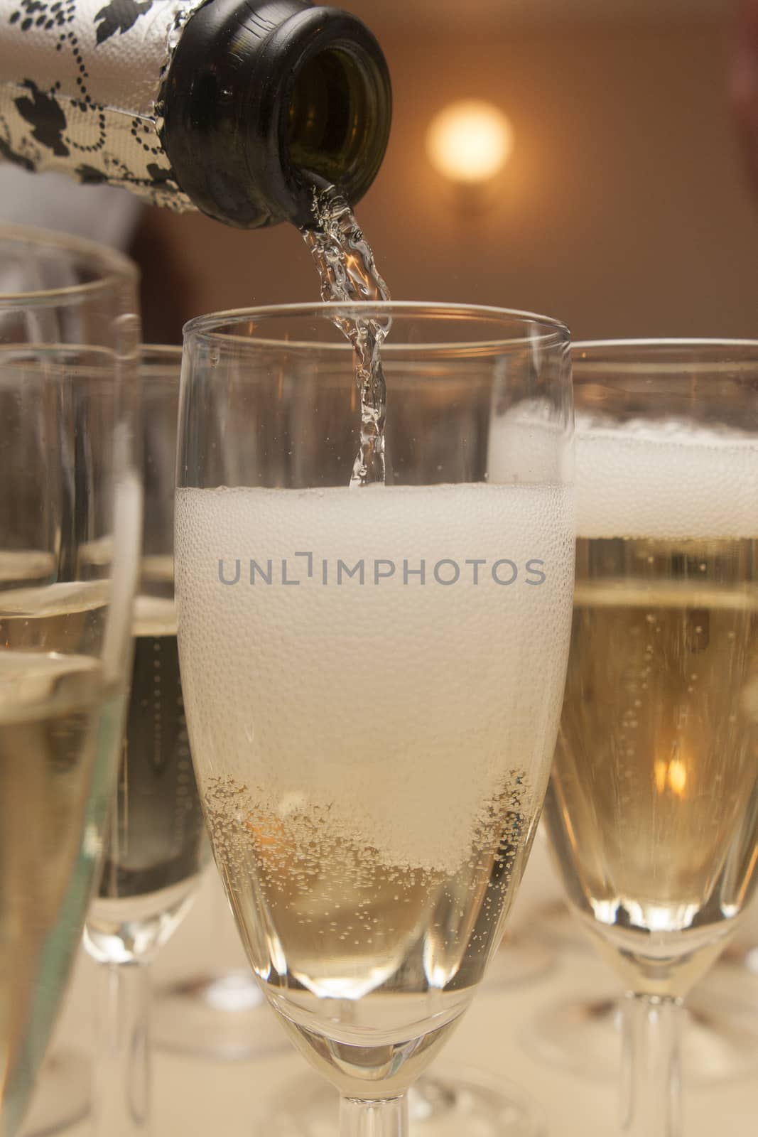 pouring champagne in crystal glass
