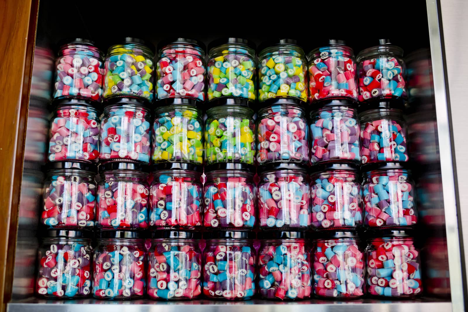 Colorful of Candy in a glass candy jar background
