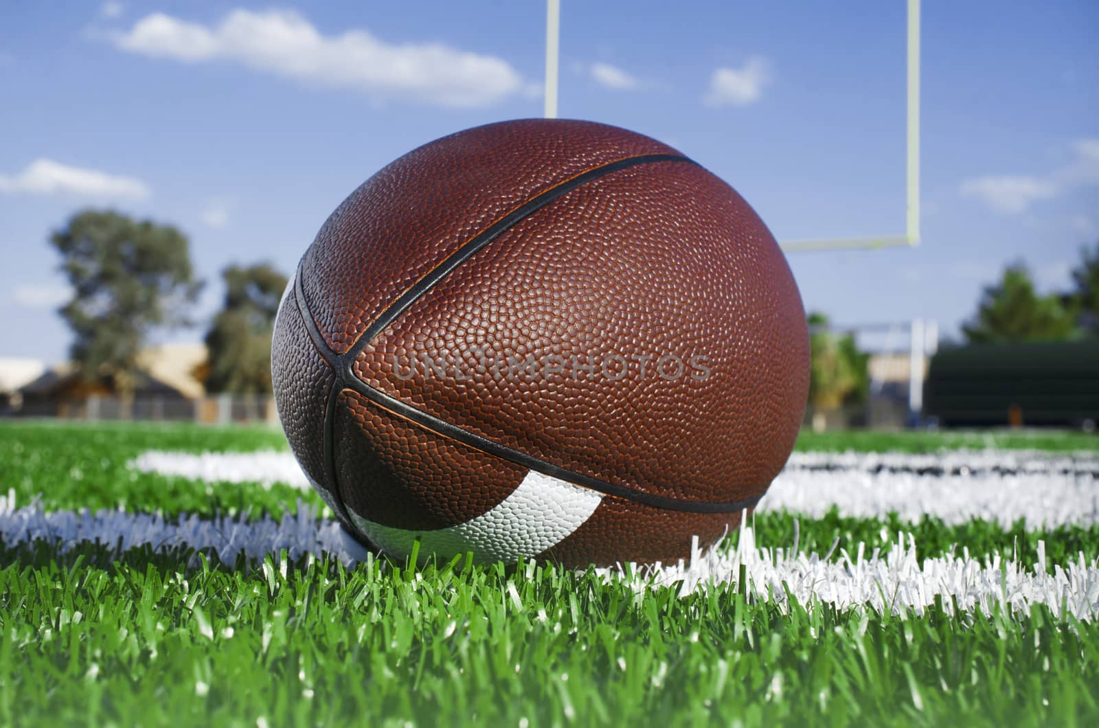 American football on find with goal posts by Paulmatthewphoto