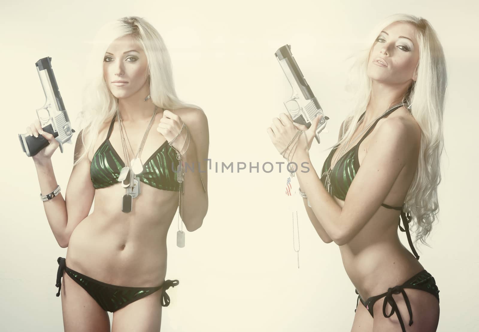 Beautiful blond woman holding gun by Paulmatthewphoto