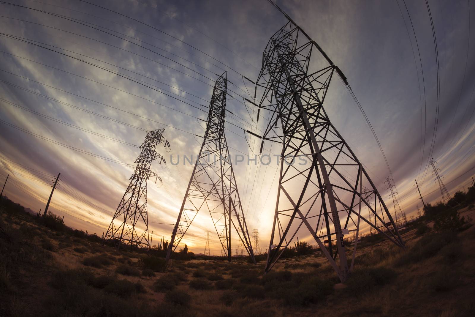 Electricity power pylons at sunset