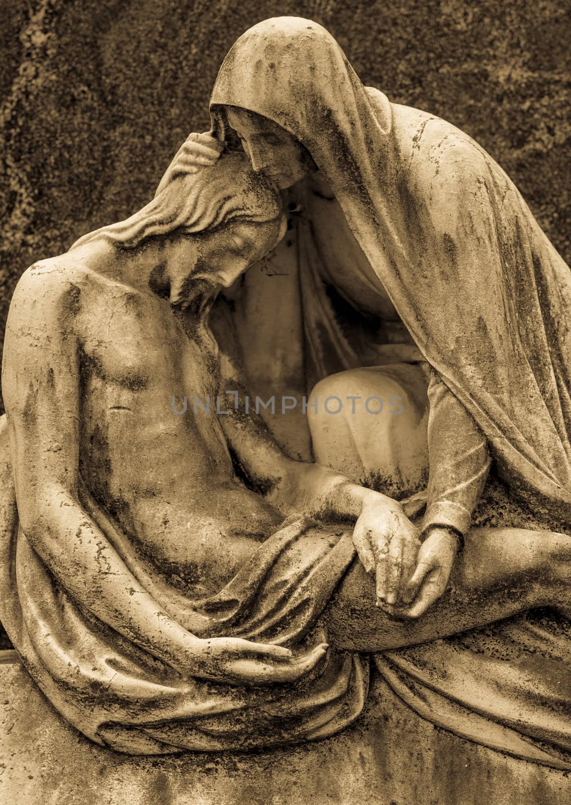 More than 100 years old statue. Cemetery located in North Italy.