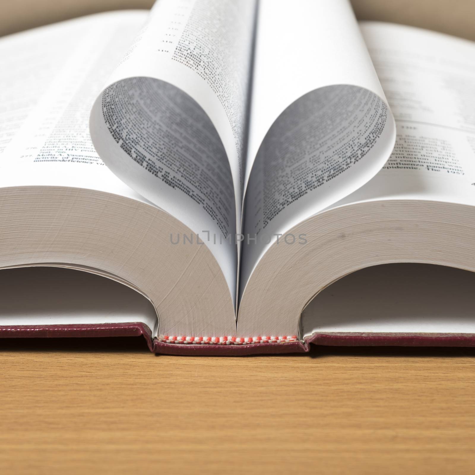 book shape heart on wood background