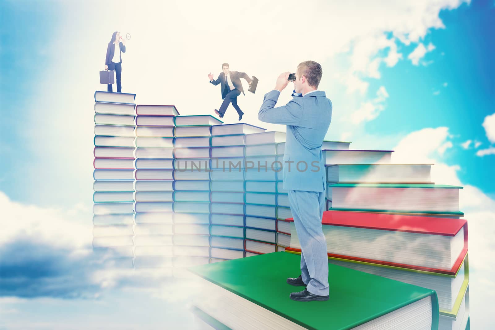 Businessman looking through binoculars against blue sky