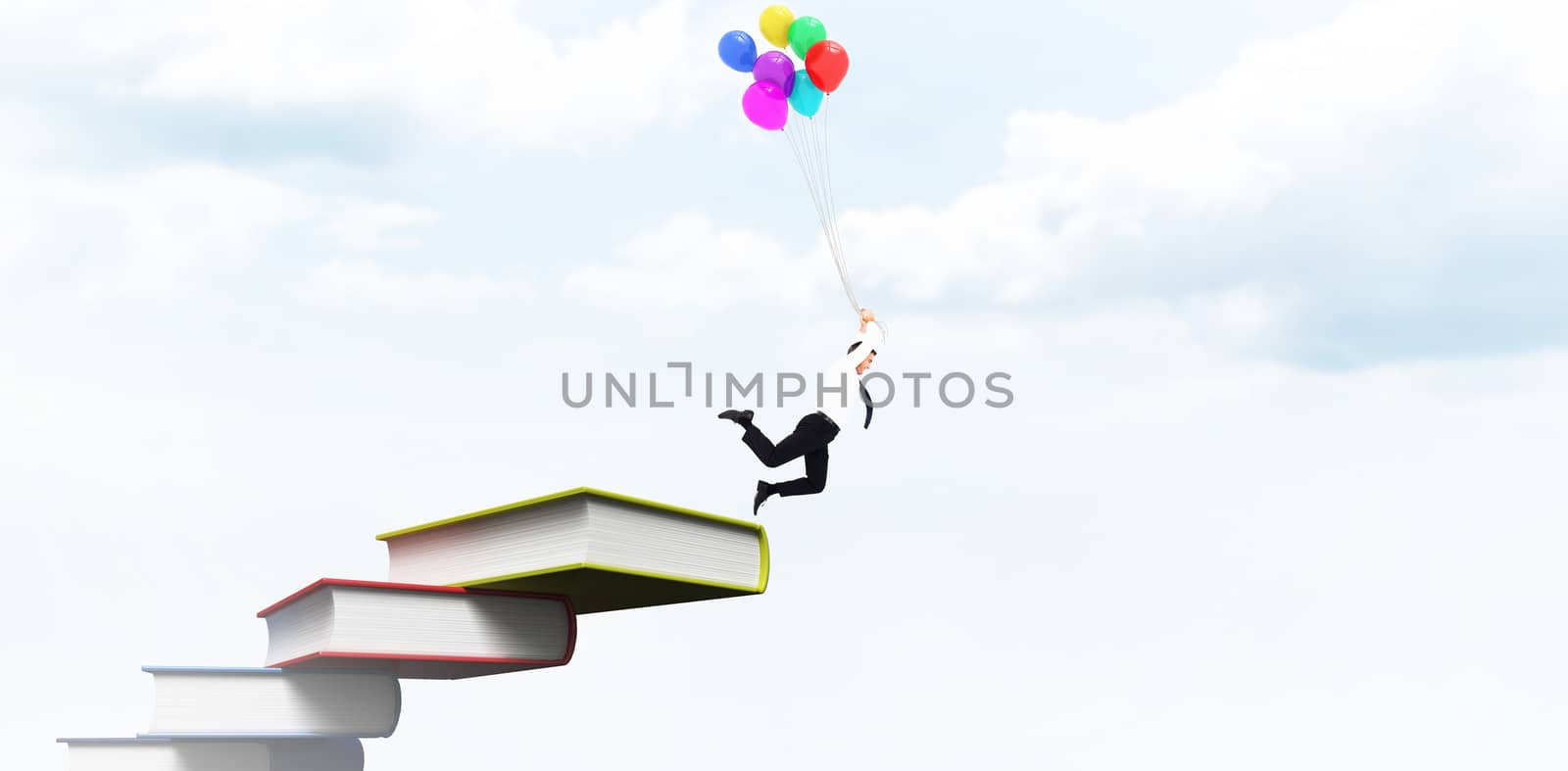 Businessman flying with balloons against blue sky