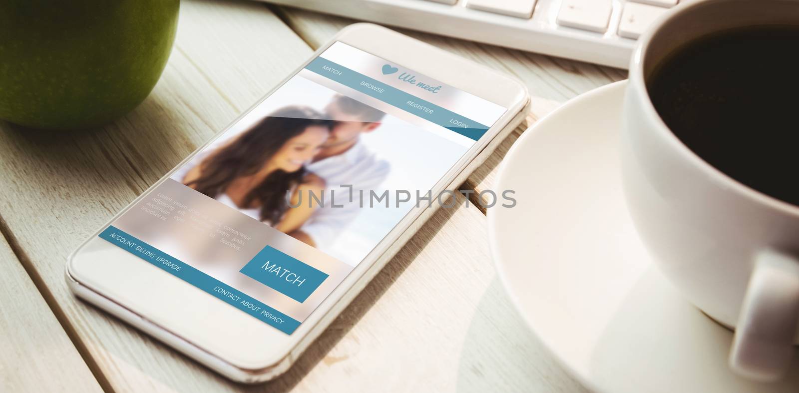 Dating website against smartphone on desk