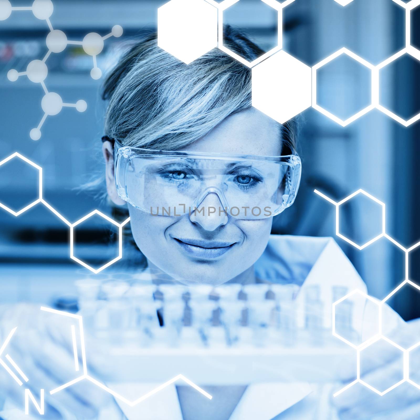 Science graphic against concentrated female scientist holding samples