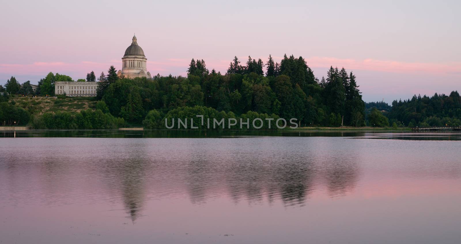 The state capital reflects in the lake of the same name at dusk in Olympia, Wa