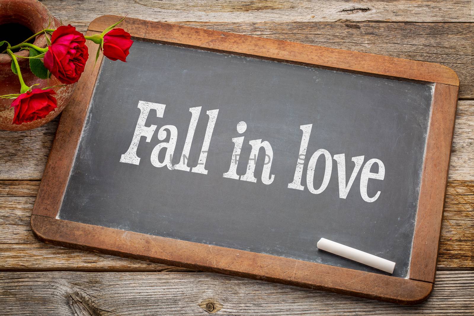 Fall in love advice  on blackboard by PixelsAway