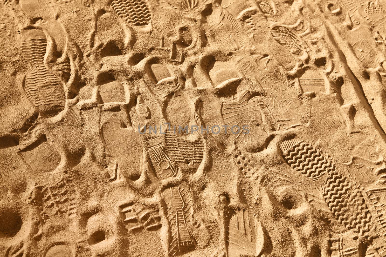 footwear prints on sand by ssuaphoto