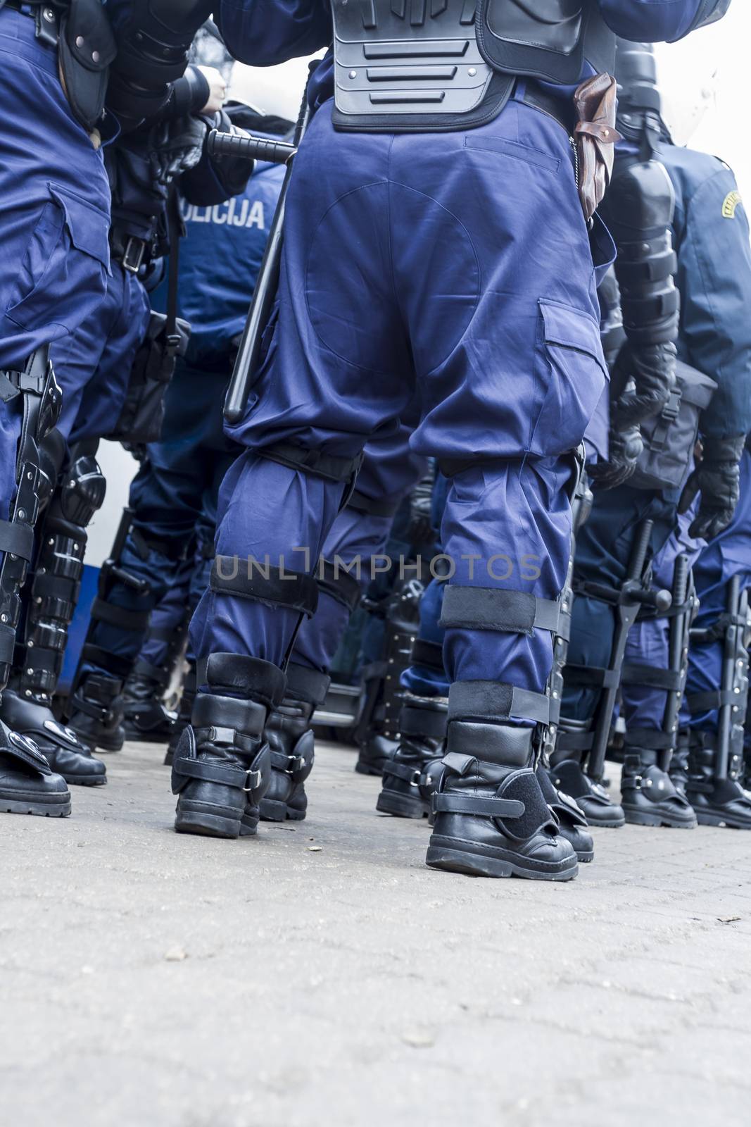 Unit of police special forces in riot gear waiting for orders.