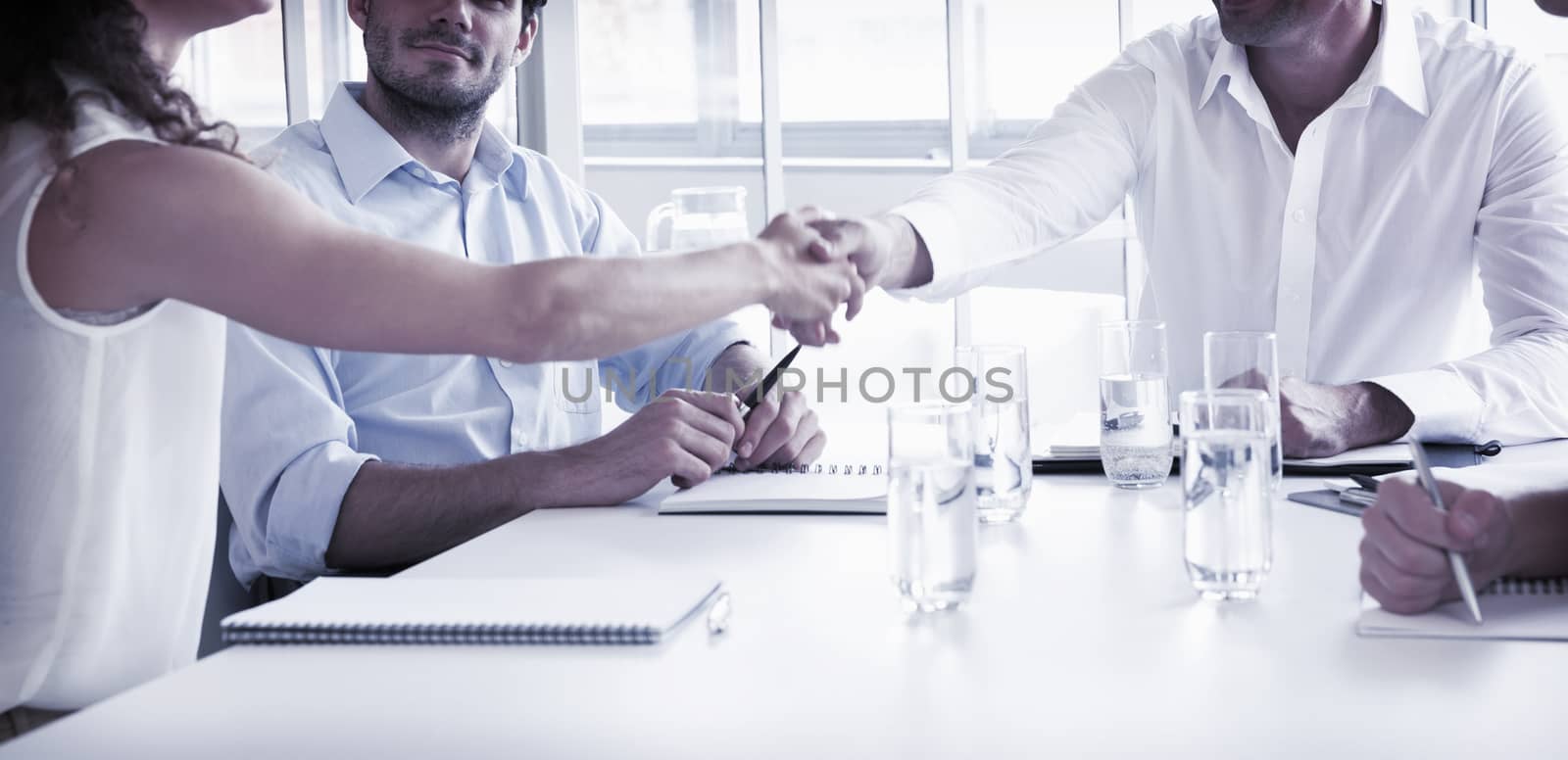 Business partners shaking hands by Wavebreakmedia