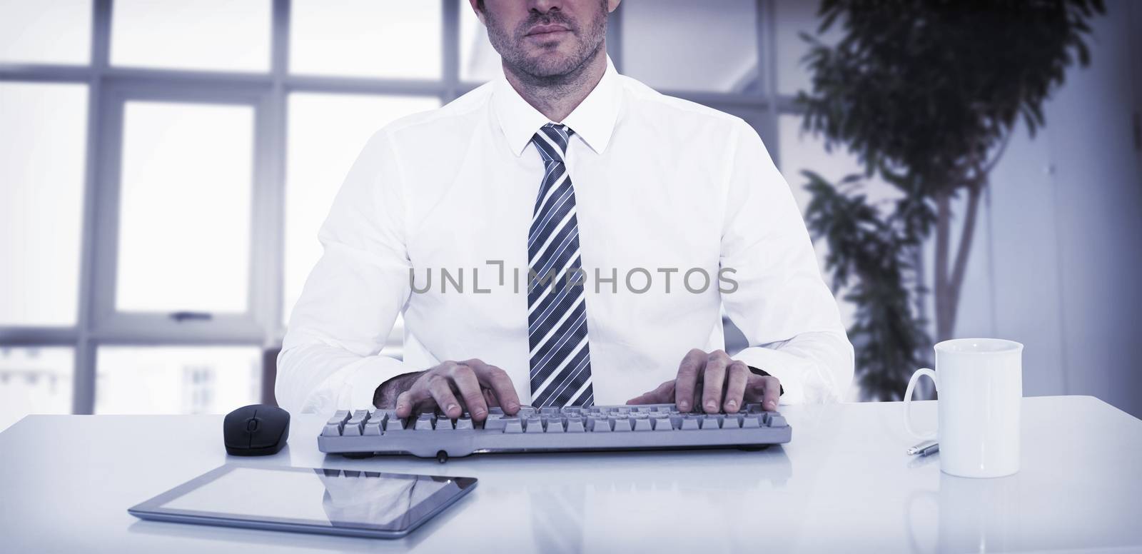 Businessman working at his desk on white background