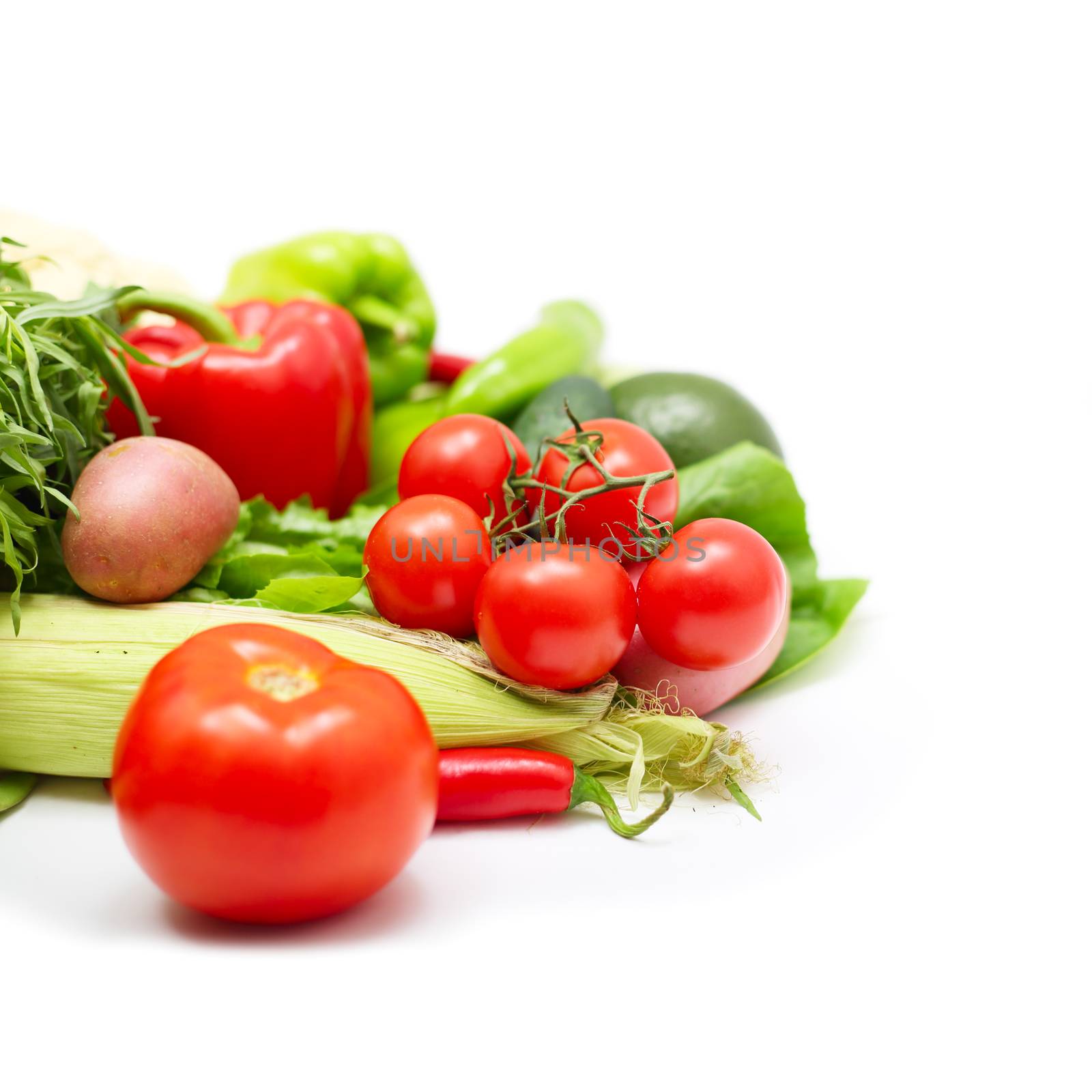 Pile of assorted vegetables isolated on white background