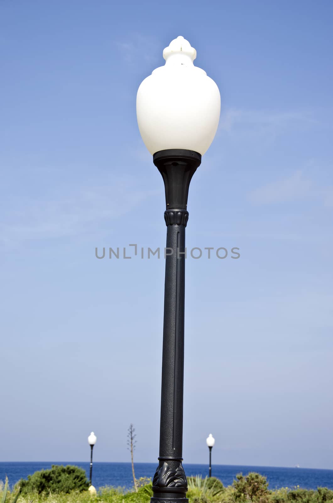 Aegean sea beach park lamps in Rhodes island, Greece