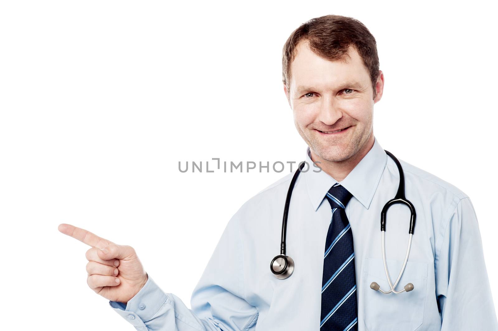 Male physician pointing to copy space