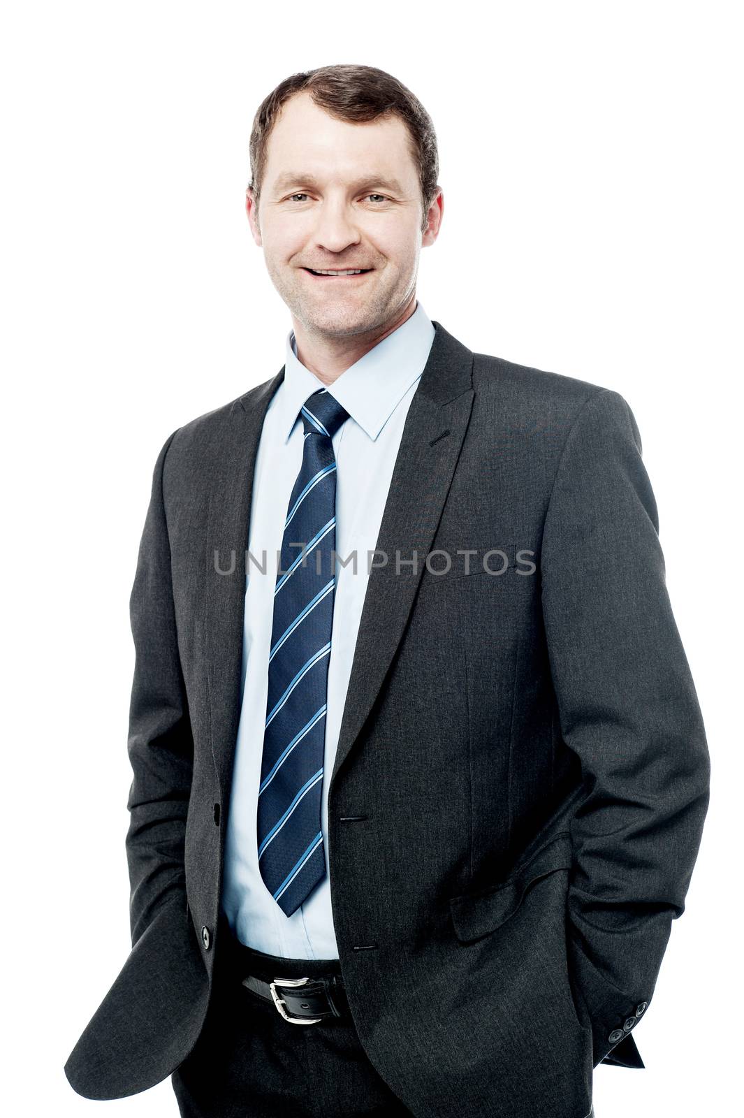 Confident smiling businessman posing by stockyimages