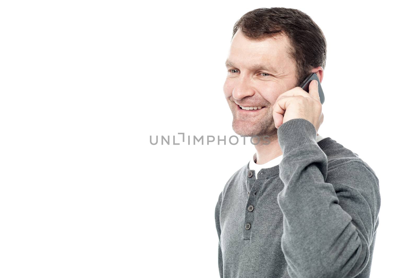 Sideways of casual man talking on cell phone