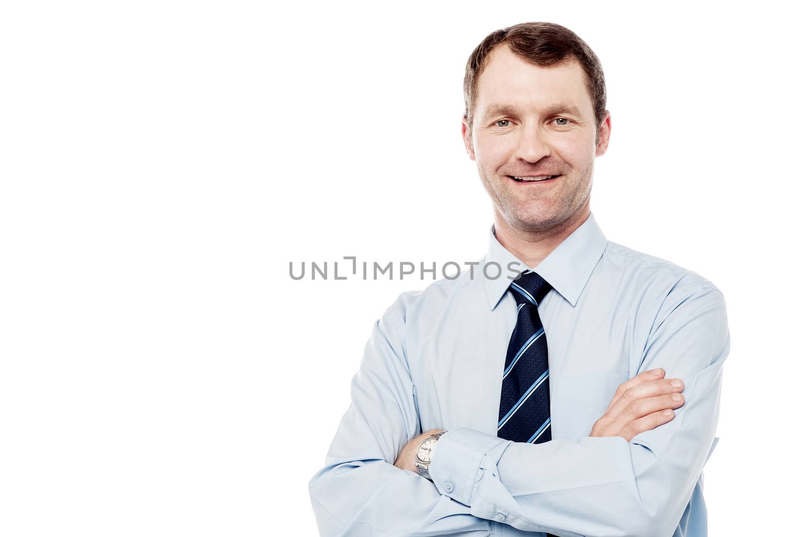 Successful male executive with folded arms