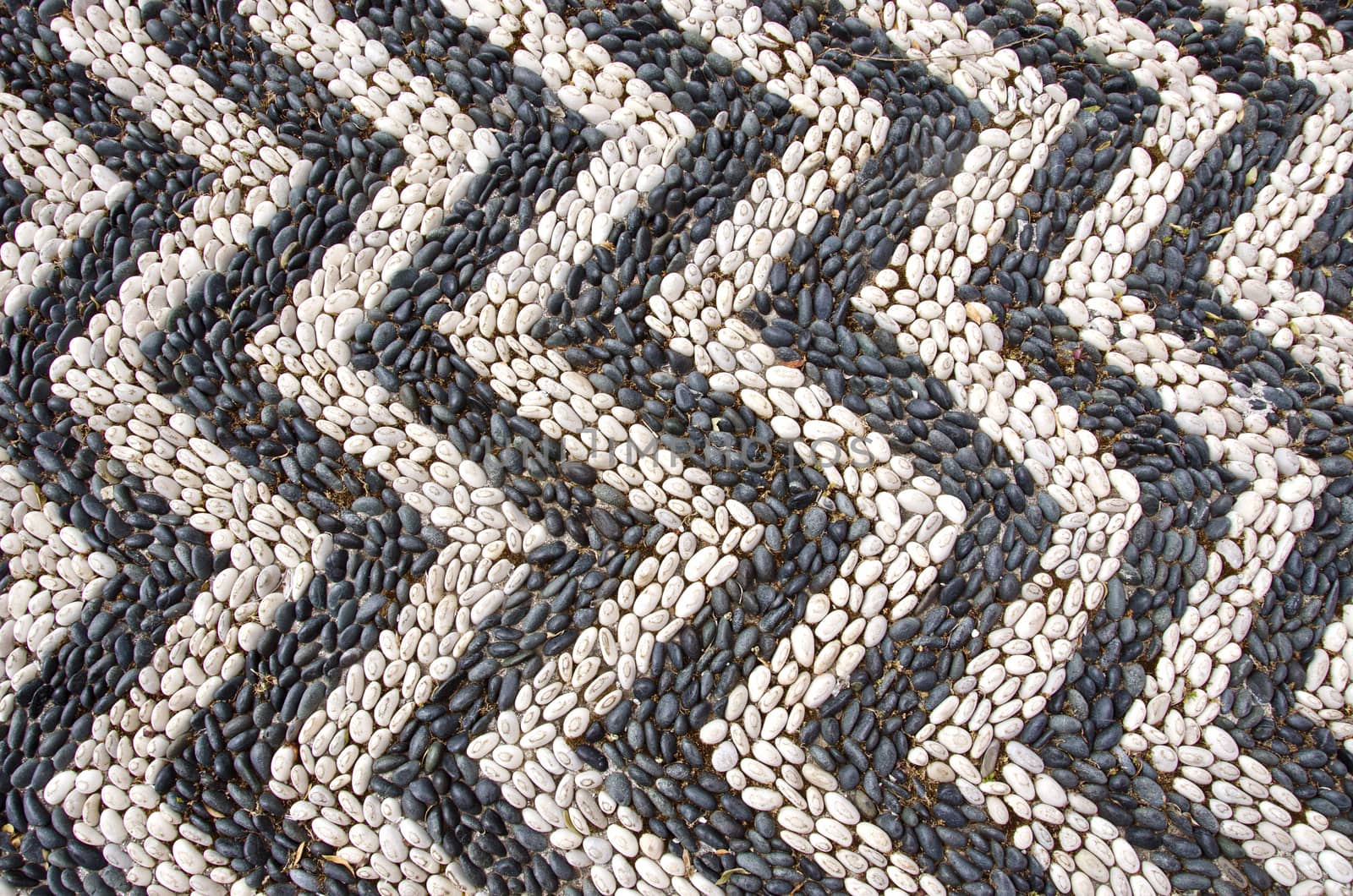 white and black stone cobblestone background and texture in Rhodes street, Greece