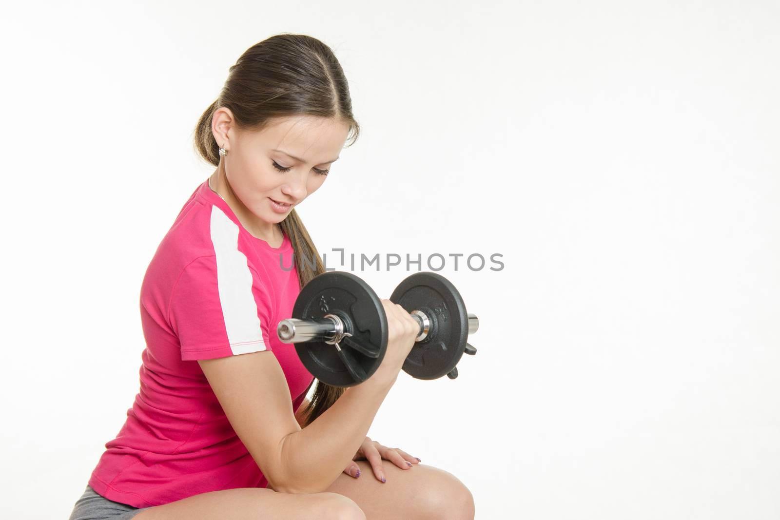 Young beautiful girl athlete spends Europeans physical exercise