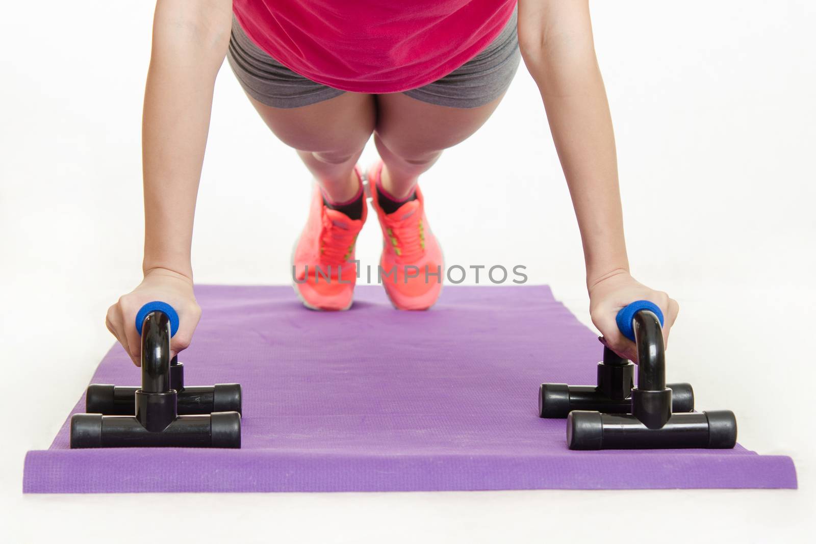 Young beautiful girl athlete spends Europeans physical exercise
