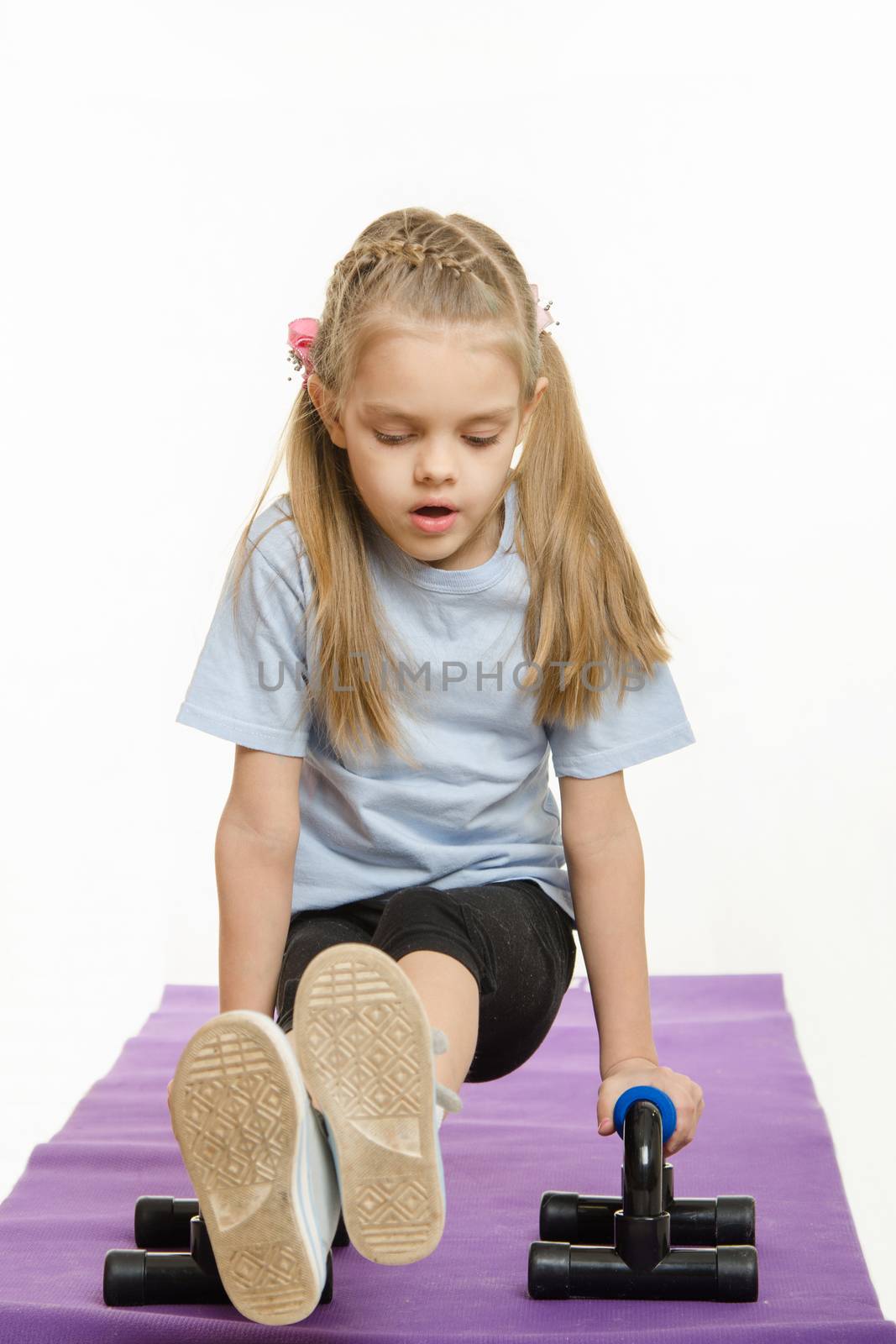 Six year old girl Europeans engaged in physical exercises