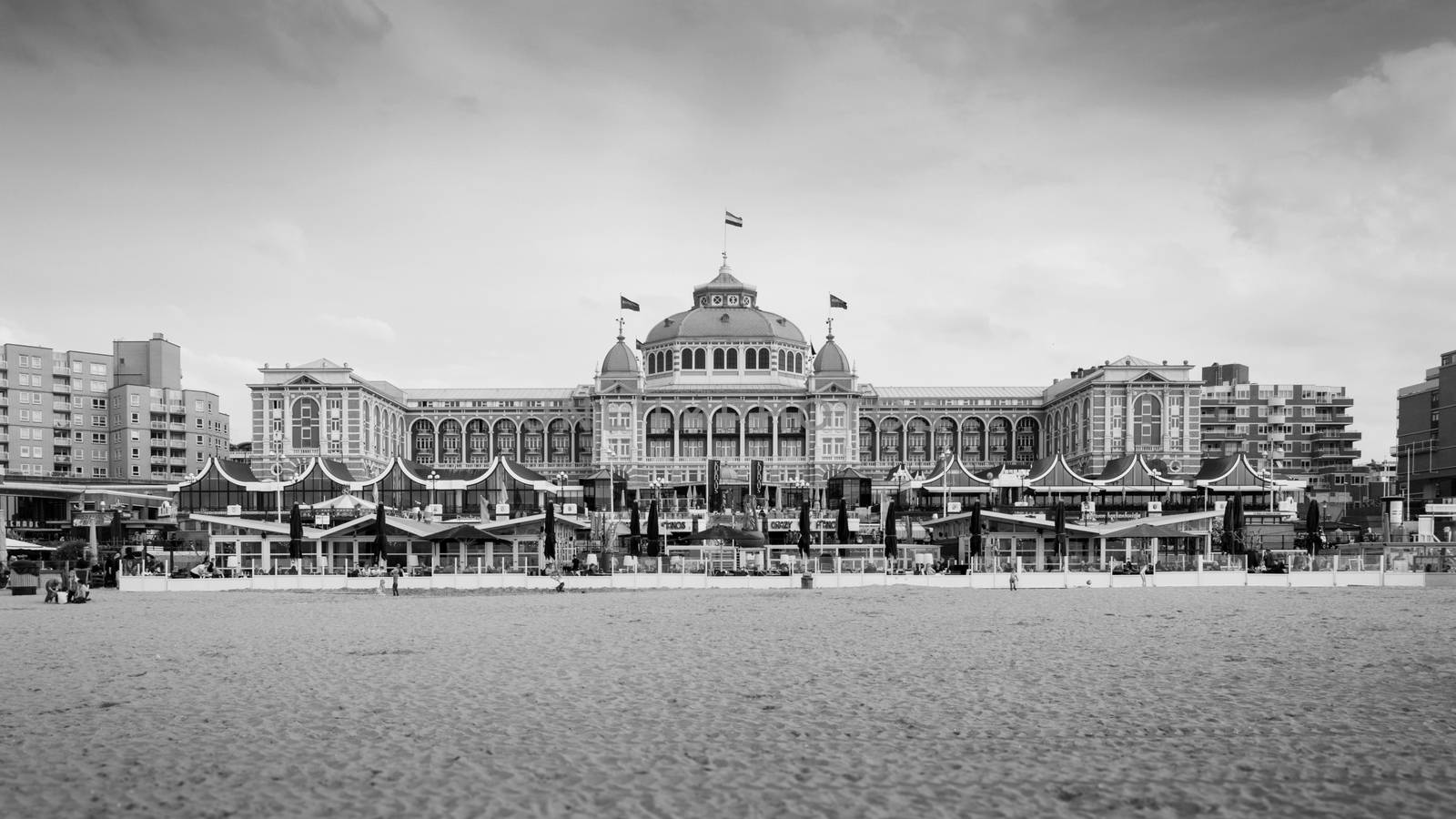 The Hague, Netherlands - May 8, 2015: Tourists at Kurhaus of Scheveningen, The Hague in the Netherlands is a hotel which is called the "Grand Hotel Amrâth Kurhaus The Hague" since October 2014. It is located in the main seaside resort area, near the beach.