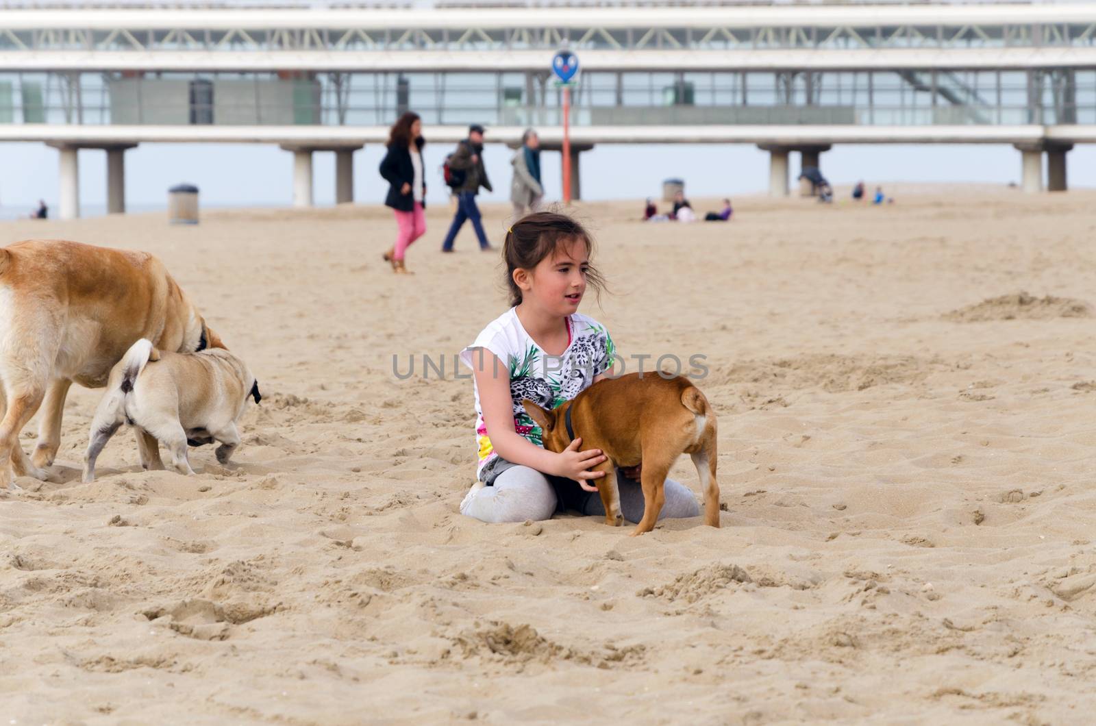 The Hague, Netherlands - May 8, 2015: Children playing at the beach, Scheveningen district in The Hague by siraanamwong