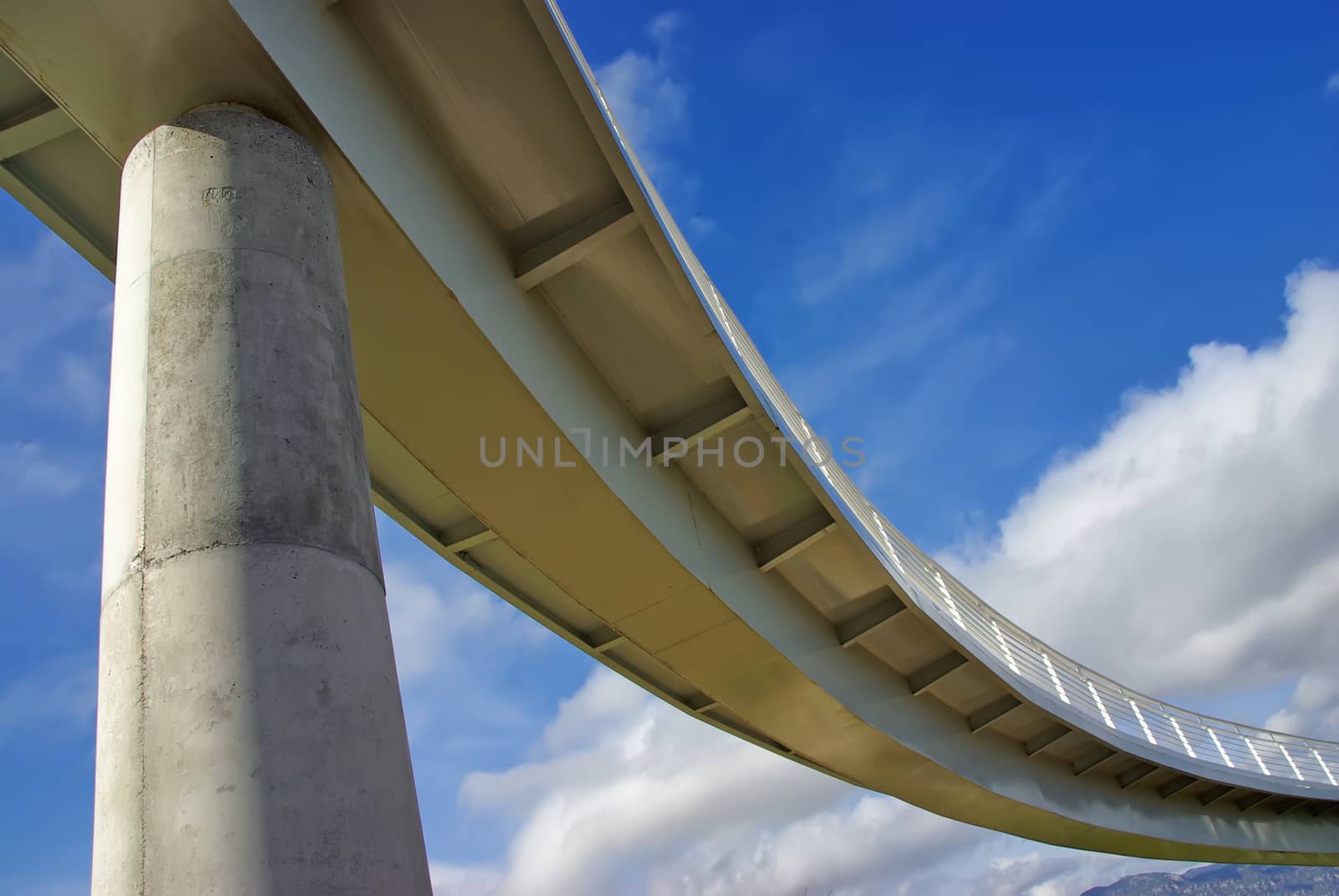 A modern pedestrian bridge as seen from below