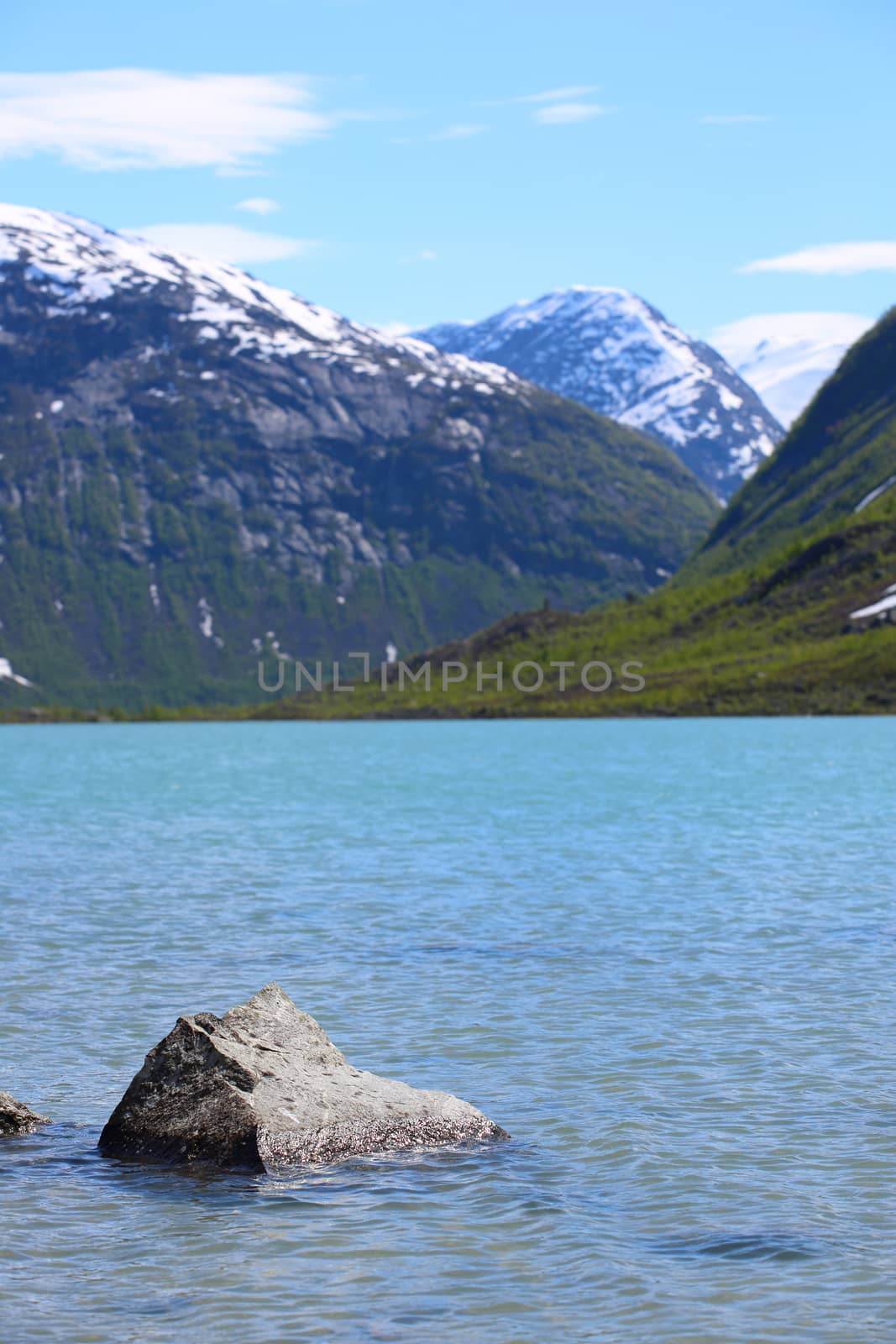 Mountain landscape with glacial river in Jostedalsbreen National Park, Briksdalen valley, Norway 