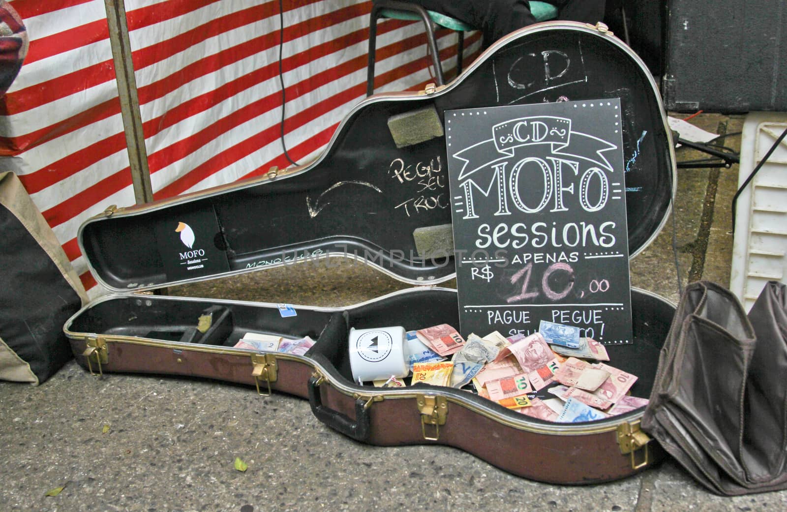 Sao Paulo, Brazil, July 18 2015: Detail of music contribution for a band in the traditional antique objects market that has been held all Saturdays in Benedito Calixto square in Sao Paulo Brazil. 