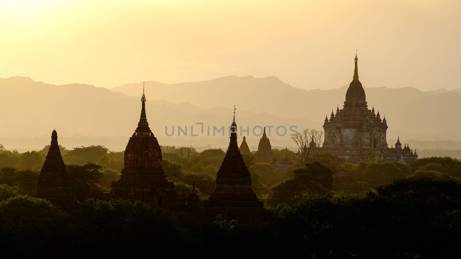 Sunset scenic view with silhouettes of temples in Bagan, Myanmar by martinm303