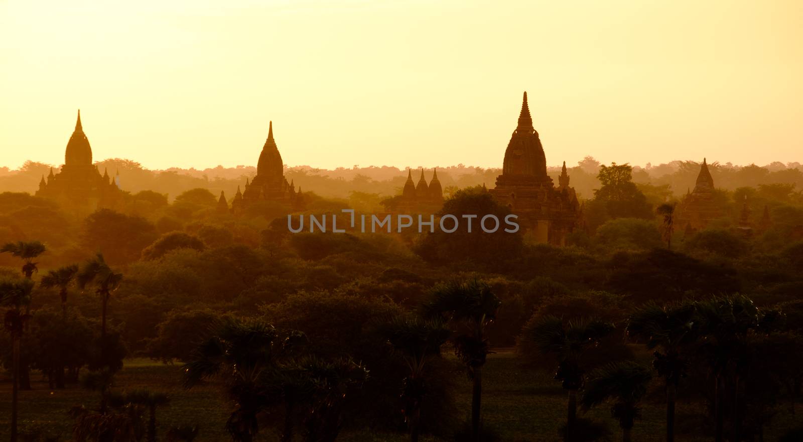 Sunrise landscape view with silhouettes of old temples, Bagan, Myanmar by martinm303