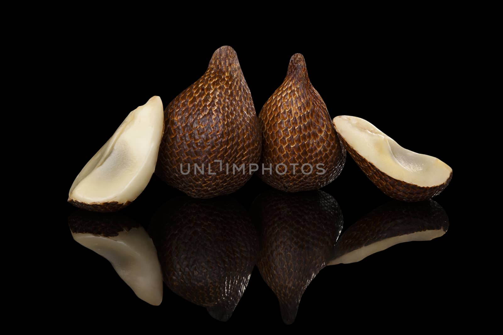 Salak fruit isolated on black background. Tropical asian fruit.