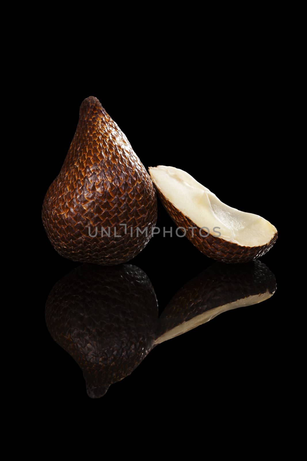 Salak fruit isolated on black background. Tropical asian fruit.