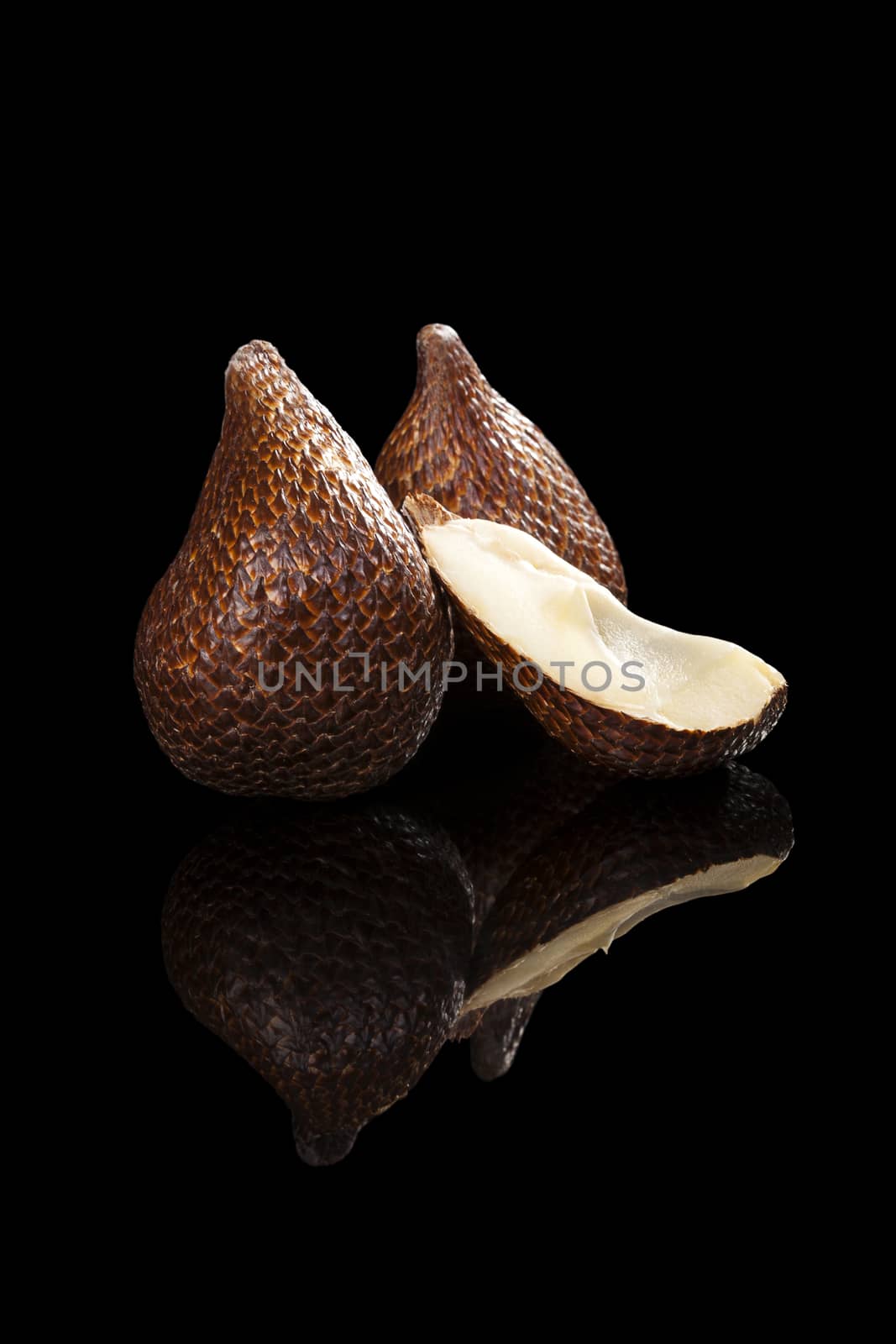 Salak fruit isolated on black background. Tropical asian fruit.