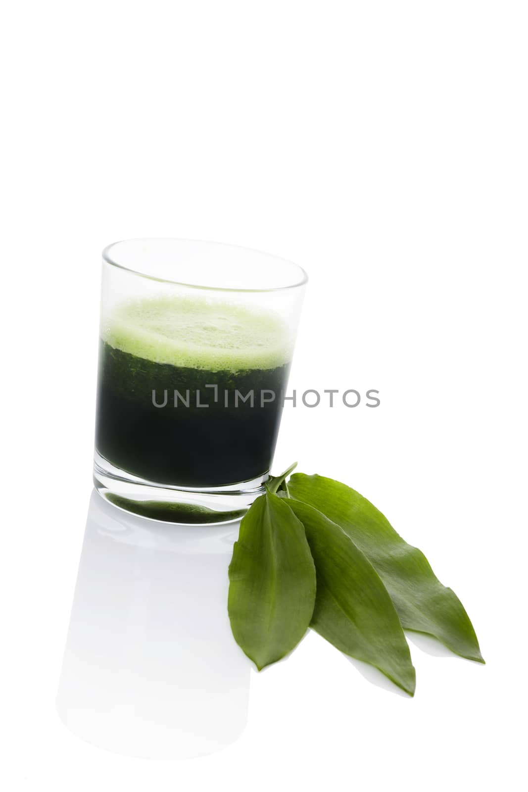 Green juice made from wild garlic with fresh wild garlic leaf isolated on white background. Spring detox, modern minimal style image. 