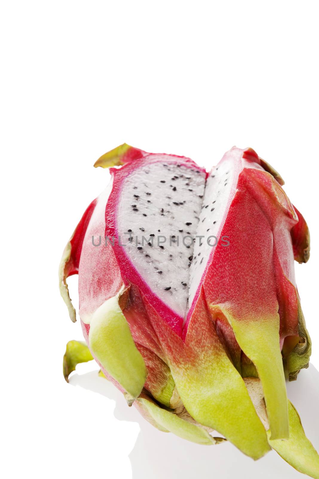 Delicious ripe dragon fruit isolated on white background. Tropical fruit, pitaya concept. Healthy eating.