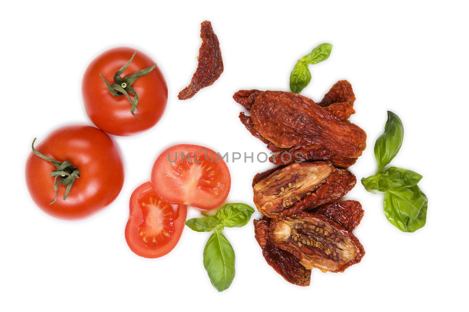 Sundried tomatos, fresh tomatoes and fresh basil herbs isolated on white background, top view. Culinary italian eating.