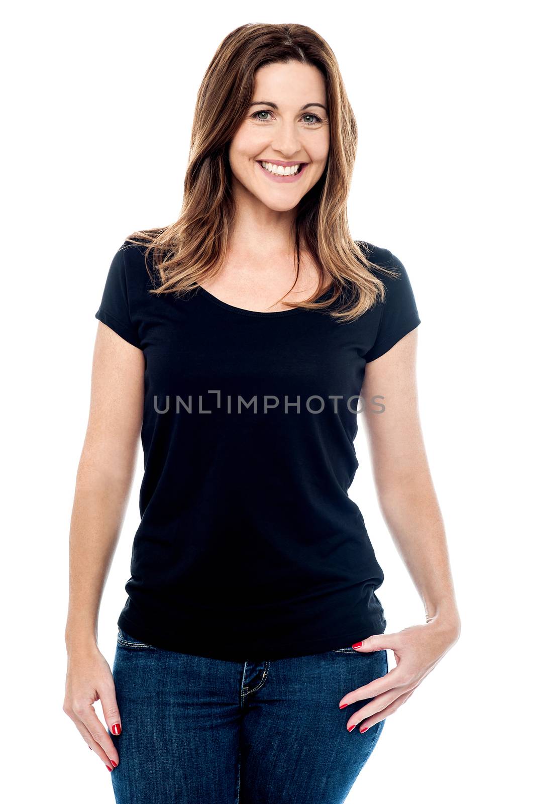 Relaxed woman posing in casual wear over white