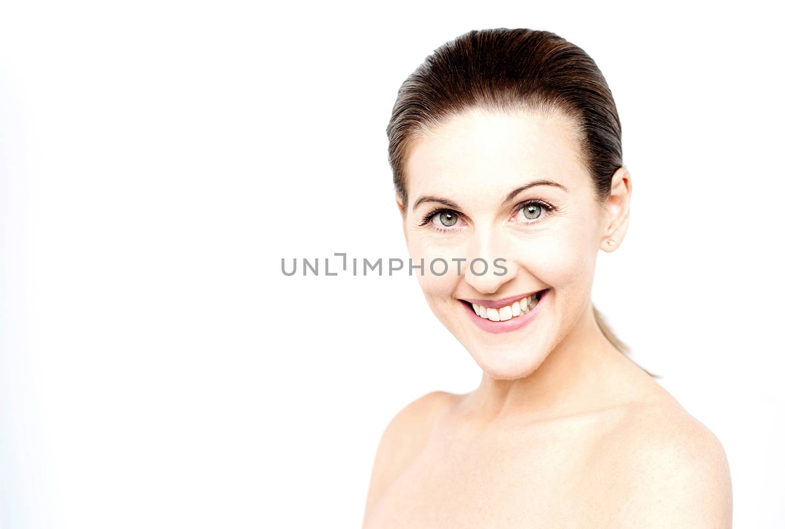 Topless woman posing to camera by stockyimages