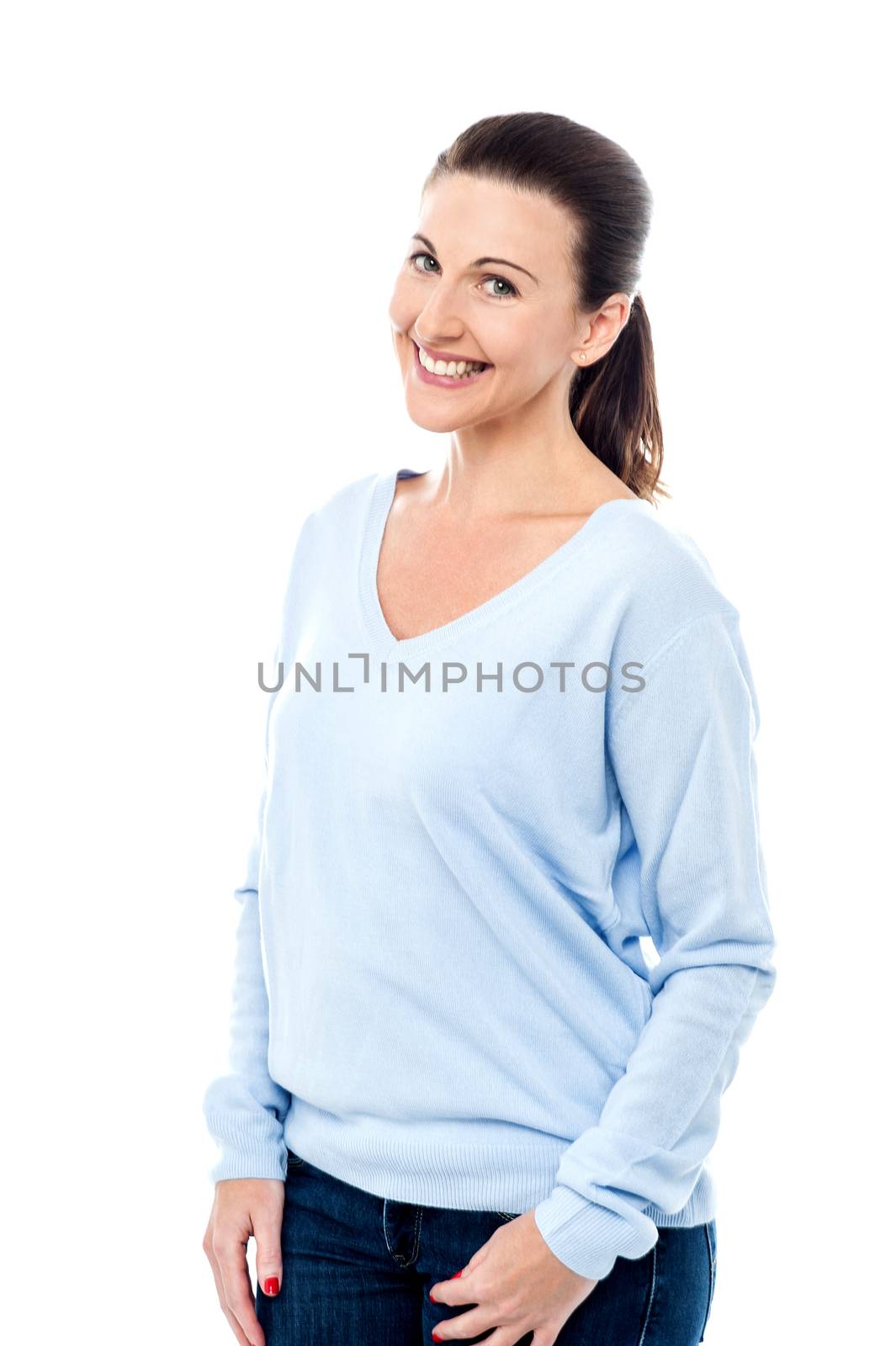 Fashionable woman posing with hands in pockets