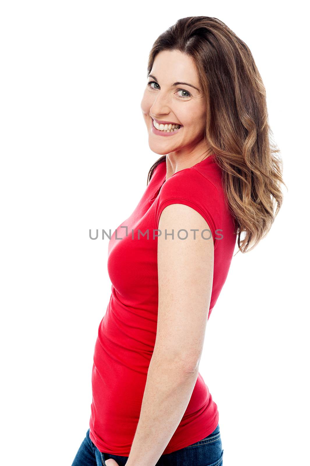 Sideways of cheerful woman by stockyimages
