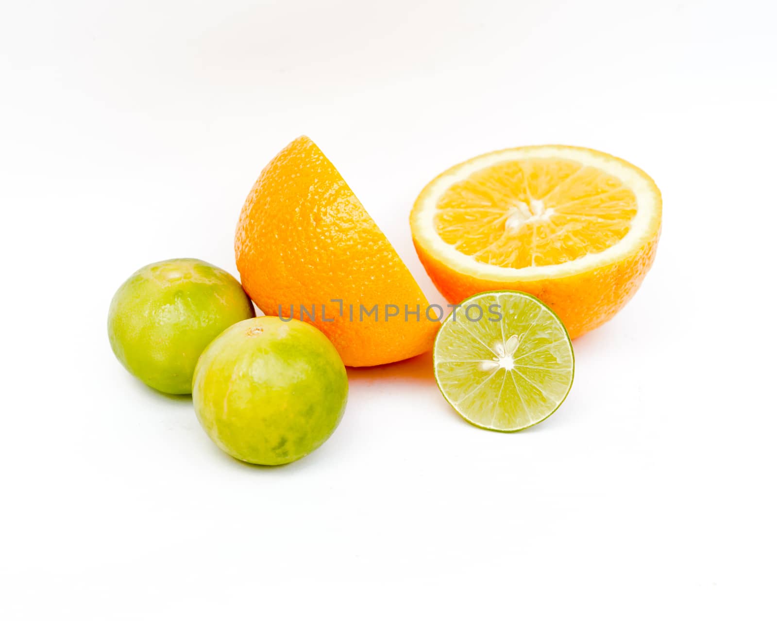 Slice of fresh orange and Slice of fresh lime on white background.Healthy citrus fruity food.